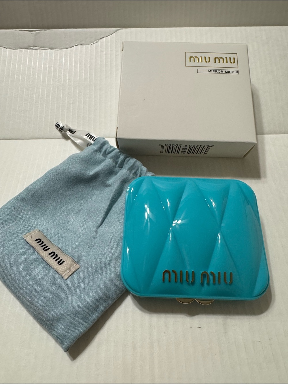 Miu Miu Quilted Gloss Compact Mirror in Bright Turquoise
